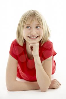 Young Girl Lying On Stomach In Studio