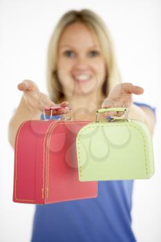 Royalty Free Photo of a Woman With Two Small Suitcases