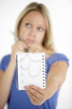 Royalty Free Photo of a Woman With a Notebook