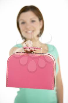 Royalty Free Photo of a Girl With a Small Suitcase