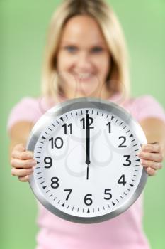 Royalty Free Photo of a Woman With a Clock