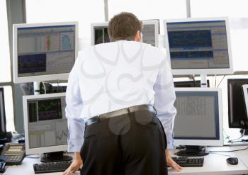 Royalty Free Photo of a Stock Trader Looking at Screens