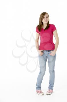 Royalty Free Photo of a Young Girl Standing With Her Fingers Hooked in Her Pants