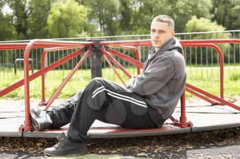 Royalty Free Photo of a Guy in a Playground