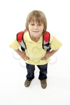 Studio Portrait of Smiling Boy Holding Ruck Sack