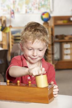 Royalty Free Photo of a Littel Boy Playing at Preschool