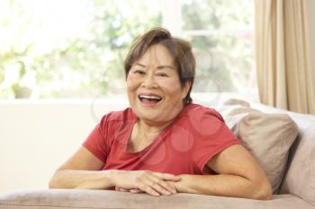 Royalty Free Photo of an Asian Woman at Home