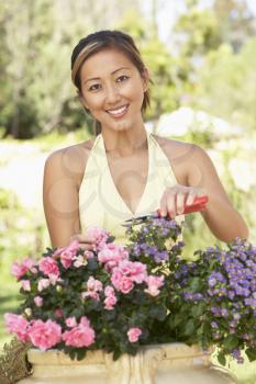 Royalty Free Photo of an Asian Woman in a Garden