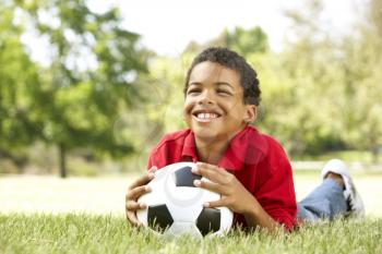 Boy In Park With Football