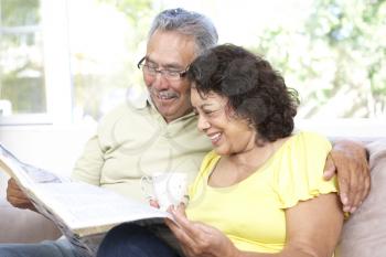 Senior Couple Using Laptop At Home