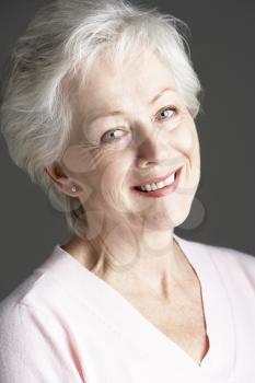 Studio Portrait Of Smiling Senior Woman