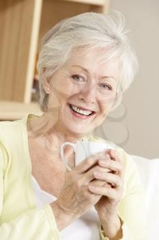 Senior Woman Enjoying Hot Drink At Home