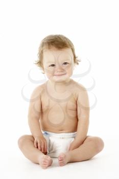 Studio Portrait Of Baby Boy Sitting