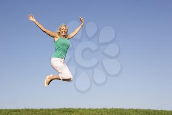 Senior woman  jumping in air