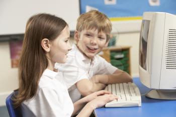 Schoolchildren In IT Class Using Computer