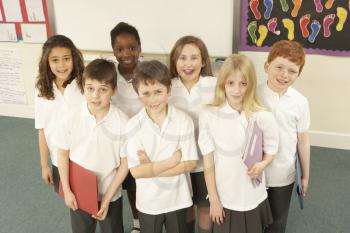 Portrait Of Schoolchildren Standing In Classroom