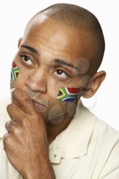 Disappointed Young Male Sports Fan With South African Flag Painted On Face
