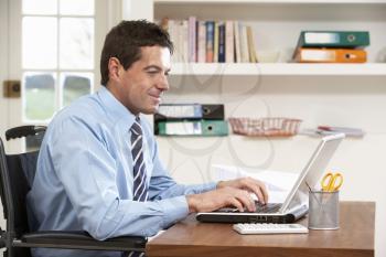 Man Working From Home Using Laptop