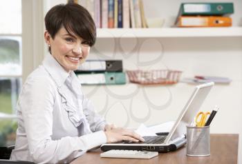 Woman Working From Home Using Laptop