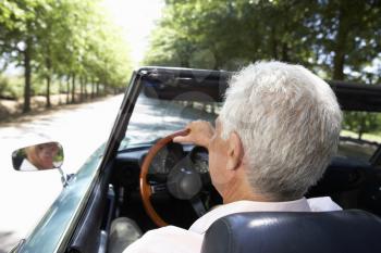 Senior man in sports car