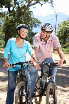 Senior couple on country bike ride