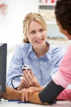 Young doctor with female patient