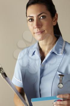 UK nurse holding prescription drug pack