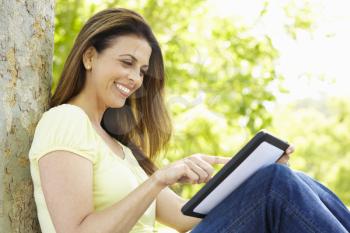 Woman using tablet outdoors
