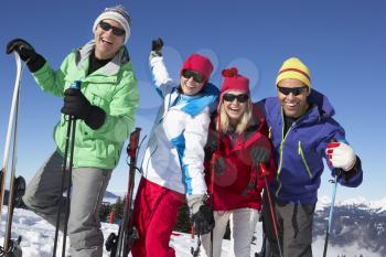 Group Of Middle Aged Couples On Ski Holiday In Mountains