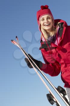 Middle Aged Woman On Ski Holiday In Mountains