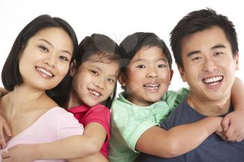 Studio Shot Of Chinese Family