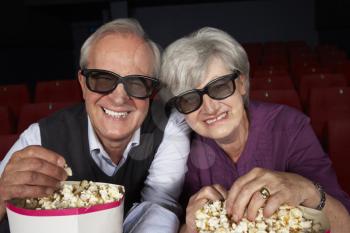 Senior Couple Watching 3D Film In Cinema