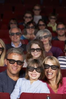 Family Watching 3D Film In Cinema