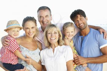 Multi Generation Family Enjoying Beach Holiday