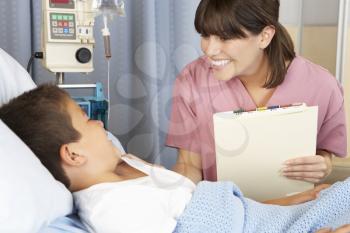 Nurse Visiting Child Patient On Ward