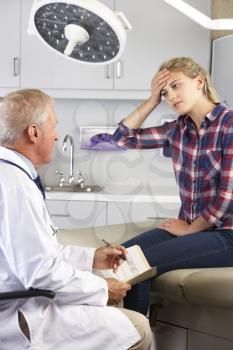 Teenage Girl Visits Doctor's Office With Headaches