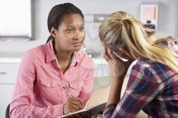 Teenage Girl Visits Doctor's Office Suffering With Depression