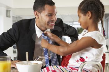 Daughter Straightens Father's Tie Before He Leaves For Work