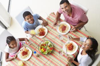 Overhead View Of Family Eating Meal Together