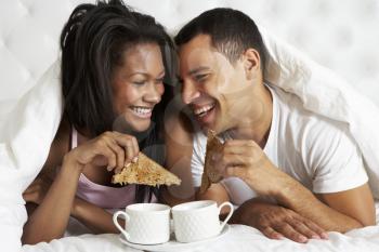 Couple Enjoying Breakfast In Bed