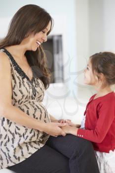 Pregnant Mother With Daughter At Home