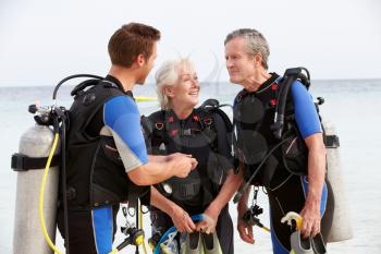 Senior Couple Having Scuba Diving Lesson With Instructor