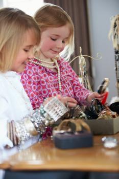 Two Girls Playing With Jewelry And Make Up