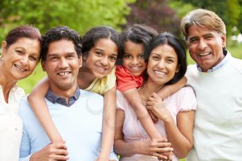 Muti-Generation Indian Family Walking In Countryside
