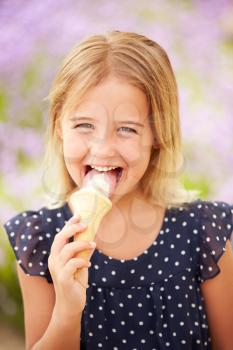 Young Girl Eating Ice Cream Outdoors
