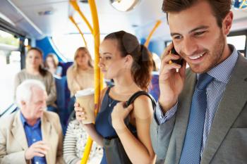 Passengers Standing On Busy Commuter Bus