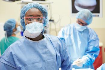 Portrait Of Surgeon Working In Operating Theatre