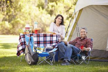 Couple Enjoying Camping Holiday In Countryside