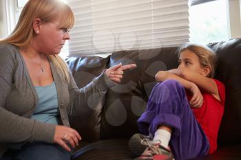 Mother Telling Off Daughter At Home