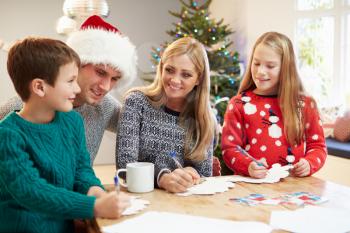 Family Writing Christmas Cards Together